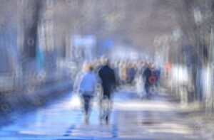 A blurred photo of people in the crowd, A blurred vision of a person with diabetes due to high blood sugar