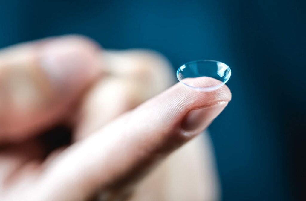 Close-up of a contact lens resting on a person's index finger.